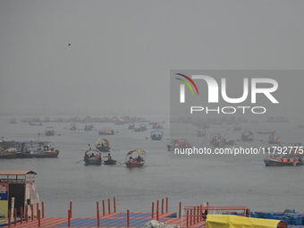 People take boat rides amid heavy smoggy conditions at Sangam, the confluence of the rivers Ganges, Yamuna, and Saraswati, in Prayagraj, Ind...