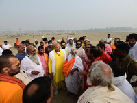 Sadhus (holy men) arrive on the banks of the Sangam area for the allotment of land for the Maha Kumbh 2025 Festival in Prayagraj, India, on...