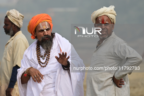 Sadhus (holy men) arrive on the banks of the Sangam area for the allotment of land for the Maha Kumbh 2025 Festival in Prayagraj, India, on...