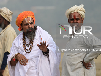 Sadhus (holy men) arrive on the banks of the Sangam area for the allotment of land for the Maha Kumbh 2025 Festival in Prayagraj, India, on...