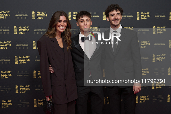 Francesco Pecco Bagnaia (R) of Italy and Ducati Lenovo Team with his wife Domizia Castagnini (L) and his brother Filippo Bagnaia (C) on the...