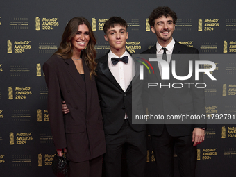 Francesco Pecco Bagnaia (R) of Italy and Ducati Lenovo Team with his wife Domizia Castagnini (L) and his brother Filippo Bagnaia (C) on the...