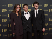 Francesco Pecco Bagnaia (R) of Italy and Ducati Lenovo Team with his wife Domizia Castagnini (L) and his brother Filippo Bagnaia (C) on the...