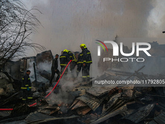 Firefighters work to extinguish a fire on residential houses in Srinagar, Jammu and Kashmir, on November 19, 2024. (