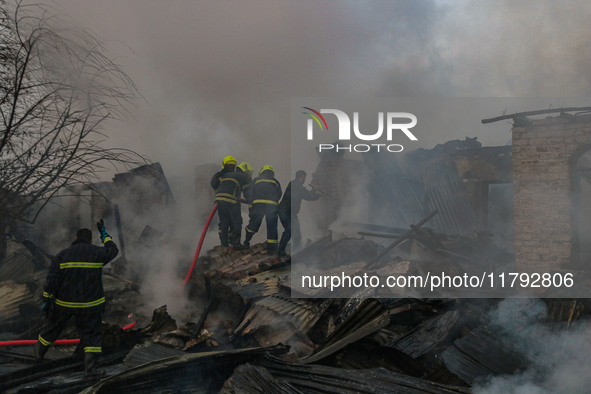 Firefighters work to extinguish a fire on residential houses in Srinagar, Jammu and Kashmir, on November 19, 2024. 