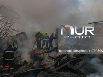 Firefighters work to extinguish a fire on residential houses in Srinagar, Jammu and Kashmir, on November 19, 2024. (