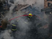 Firefighters work to extinguish a fire on residential houses in Srinagar, Jammu and Kashmir, on November 19, 2024. (