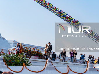 Tourists visit around the Boudhanath Stupa in Kathmandu, Nepal, on November 19, 2024. (