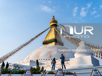 Tourists visit around the Boudhanath Stupa in Kathmandu, Nepal, on November 19, 2024. (