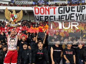 Indonesian fans cheer before the FIFA World Cup Asian 3rd Qualifier Group C match against Saudi Arabia at Gelora Bung Karno Stadium in Jakar...