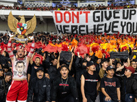 Indonesian fans cheer before the FIFA World Cup Asian 3rd Qualifier Group C match against Saudi Arabia at Gelora Bung Karno Stadium in Jakar...