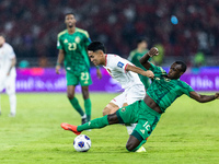 Marselino Ferdinan of Indonesia is in action during the FIFA World Cup Asian 3rd Qualifier Group C match against Saudi Arabia at Gelora Bung...