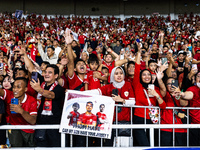 Indonesian fans cheer after the FIFA World Cup Asian 3rd Qualifier Group C match against Saudi Arabia at Gelora Bung Karno Stadium in Jakart...