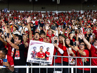 Indonesian fans cheer after the FIFA World Cup Asian 3rd Qualifier Group C match against Saudi Arabia at Gelora Bung Karno Stadium in Jakart...