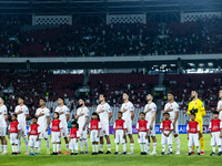 Indonesian players line up during the national anthems before the FIFA World Cup Asian 3rd Qualifier Group C match against Saudi Arabia at G...