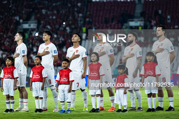 Indonesian players line up during the national anthems before the FIFA World Cup Asian 3rd Qualifier Group C match against Saudi Arabia at G...