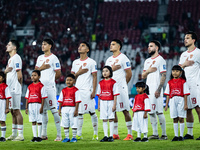 Indonesian players line up during the national anthems before the FIFA World Cup Asian 3rd Qualifier Group C match against Saudi Arabia at G...