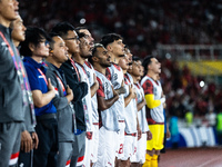 Indonesian players line up during the national anthems before the FIFA World Cup Asian 3rd Qualifier Group C match against Saudi Arabia at G...