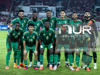 Saudi Arabia players pose for a team group photo before the FIFA World Cup Asian 3rd Qualifier Group C match against Indonesia at Gelora Bun...