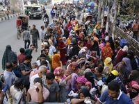 Lower-income people stand in line to buy government-subsidized food in Dhaka, Bangladesh, on November 19, 2024. (