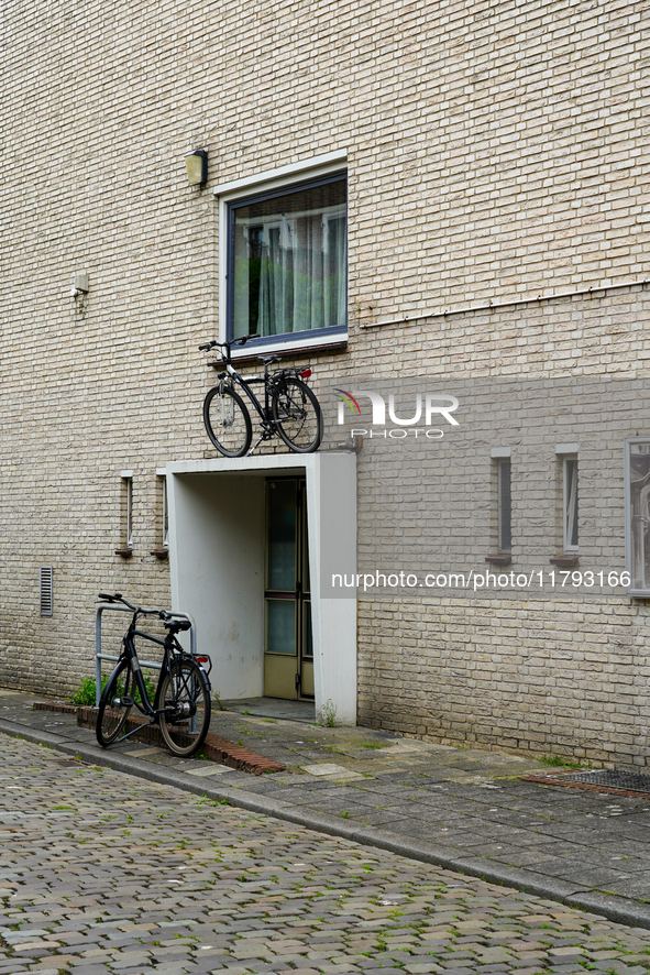 In Venlo, Netherlands, on July 28, 2023, a bicycle is stored on top of an entryway to a residential building. This display shows the Dutch i...