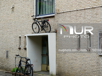 In Venlo, Netherlands, on July 28, 2023, a bicycle is stored on top of an entryway to a residential building. This display shows the Dutch i...