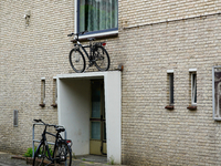 In Venlo, Netherlands, on July 28, 2023, a bicycle is stored on top of an entryway to a residential building. This display shows the Dutch i...