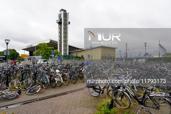 In Venlo, Netherlands, on July 28, 2023, Venlo Train Station presents a typical Dutch cycling scene with hundreds of bicycles tightly packed...