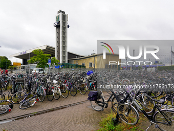 In Venlo, Netherlands, on July 28, 2023, Venlo Train Station presents a typical Dutch cycling scene with hundreds of bicycles tightly packed...