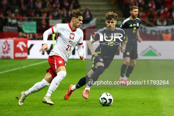 Nicola Zalewski and Ben Doak during UEFA Nations League match Poland - Scotland at National Stadium in Warsaw, Poland on November 18, 2024. 