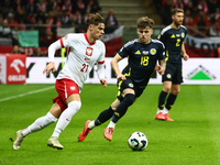 Nicola Zalewski and Ben Doak during UEFA Nations League match Poland - Scotland at National Stadium in Warsaw, Poland on November 18, 2024....