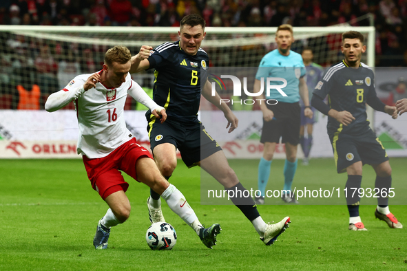 Adam Buksa and Billy Gilmour during UEFA Nations League match Poland - Scotland at National Stadium in Warsaw, Poland on November 18, 2024. 