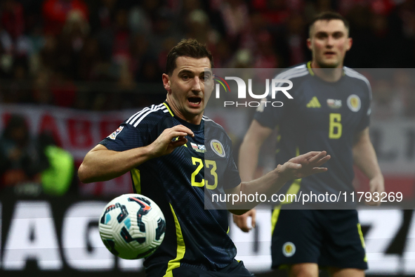 Kenny McLean and John Souttar during UEFA Nations League match Poland - Scotland at National Stadium in Warsaw, Poland on November 18, 2024....