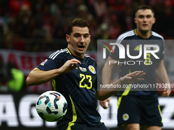 Kenny McLean and John Souttar during UEFA Nations League match Poland - Scotland at National Stadium in Warsaw, Poland on November 18, 2024....