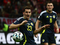 Kenny McLean and John Souttar during UEFA Nations League match Poland - Scotland at National Stadium in Warsaw, Poland on November 18, 2024....