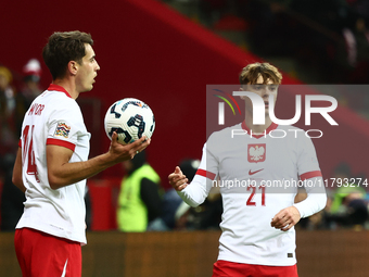 Jakub Kiwior and Nicola Zalewski during UEFA Nations League match Poland - Scotland at National Stadium in Warsaw, Poland on November 18, 20...