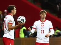 Jakub Kiwior and Nicola Zalewski during UEFA Nations League match Poland - Scotland at National Stadium in Warsaw, Poland on November 18, 20...