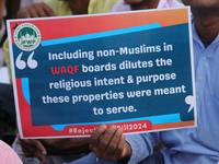 Indian Muslims shout slogans during a protest against the Anti-Waqf Amendment Bill in Kolkata, India, on November 19, 2024. More than 60 tho...