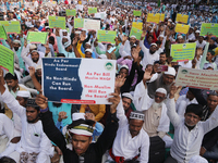 Indian Muslims shout slogans during a protest against the Anti-Waqf Amendment Bill in Kolkata, India, on November 19, 2024. More than 60 tho...