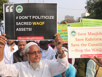 Indian Muslims shout slogans during a protest against the Anti-Waqf Amendment Bill in Kolkata, India, on November 19, 2024. More than 60 tho...