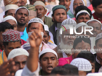 Indian Muslims shout slogans during a protest against the Anti-Waqf Amendment Bill in Kolkata, India, on November 19, 2024. More than 60 tho...