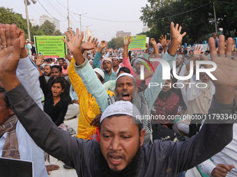 Indian Muslims shout slogans during a protest against the Anti-Waqf Amendment Bill in Kolkata, India, on November 19, 2024. More than 60 tho...