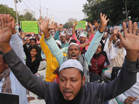 Indian Muslims shout slogans during a protest against the Anti-Waqf Amendment Bill in Kolkata, India, on November 19, 2024. More than 60 tho...