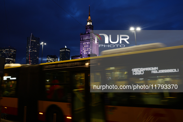 A city bus passes by as the Palace of Culture and Science is seen in Warsaw, Poland on November 18, 2024. 