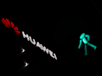 Huawei logo on the building and green traffic light are seen in Warsaw, Poland on November 18, 2024. (