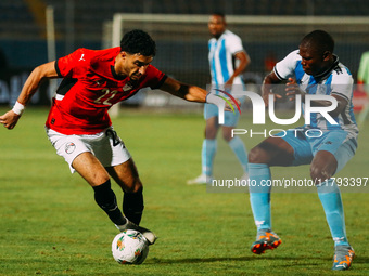 Egyptian player Omar Marmoush competes against a Botswana player during the Africa Cup of Nations Qualifiers match between Egypt and Botswan...