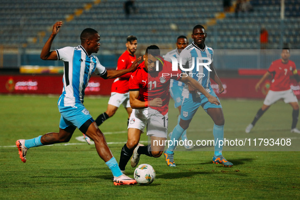 Egyptian player Mostafa Mohamed plays against a Botswana player during the Africa Cup of Nations Qualifiers match in Cairo, Egypt, on Novemb...