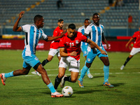 Egyptian player Mostafa Mohamed plays against a Botswana player during the Africa Cup of Nations Qualifiers match in Cairo, Egypt, on Novemb...