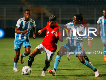 Egyptian player Nasser Maher competes against a Botswana player during the Africa Cup of Nations Qualifiers match between Egypt and Botswana...