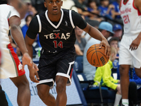 Tyson Walker #14 of Texas Legends handles the ball against Memphis Hustle during the NBA G League regular season match at Comerica Center in...